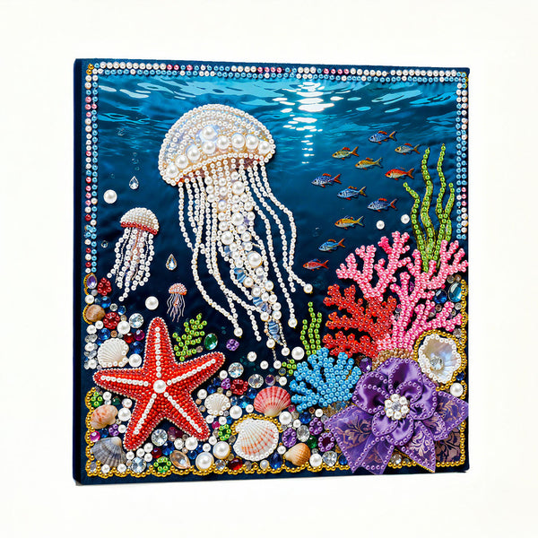 Decorative panel with beaded jellyfish, starfish, and coral on a blue background