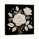 Decorative wall art with white and gold floral design on a black background