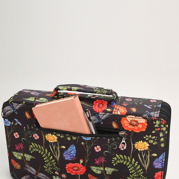 Floral-patterned makeup bag with a pink wallet inside on a white background