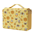 A yellow rectangular zippered cosmetic bag with a honeybee and honeycomb pattern, featuring a top handle and multiple zipper compartments on the side.