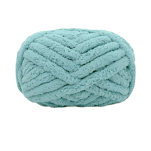 Teal skein of yarn on a white background
