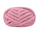 Pink braided yarn ball on a white background