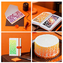 Collage of a notebook with decorative stencils, a cake with similar design, and other items on an orange background.