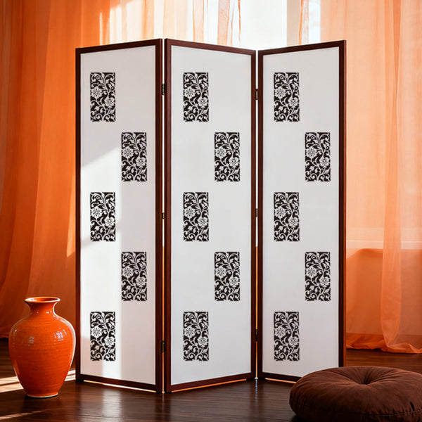 Room divider with decorative patterns in a room with orange curtains and a vase.