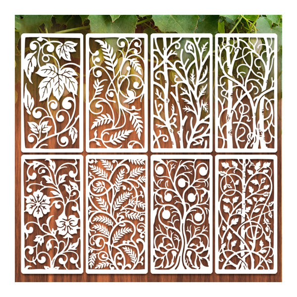 Decorative metal screens with floral and leaf patterns on a wooden background
