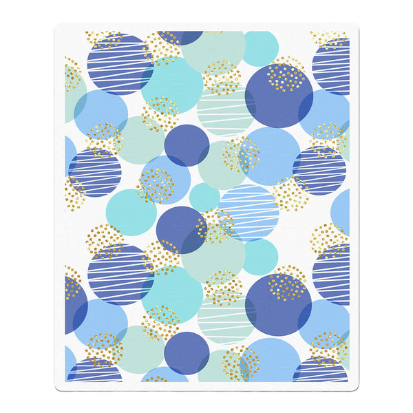 Patterned paper with blue and green circles and dots on a white background