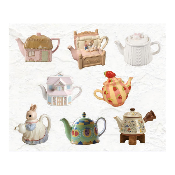 Collection of decorative teapots on a white background