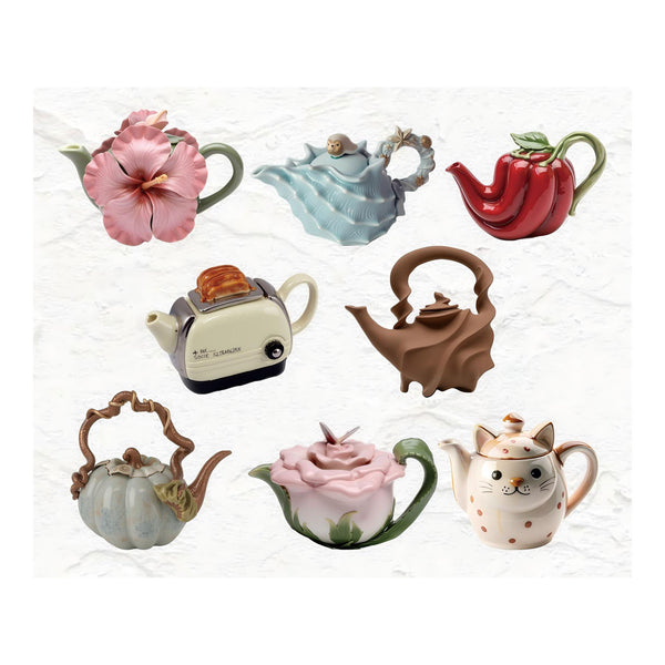 Collection of various ceramic teapots on a white background