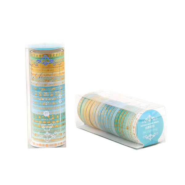 Two cylindrical containers of washi tape with decorative designs on a white background