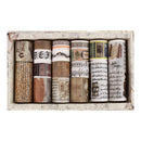 Set of decorative paper rolls with vintage designs in a wooden box