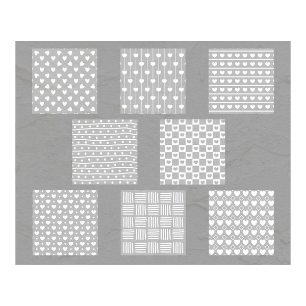 Set of nine white patterned stencils on a gray background