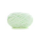 Light green skein of yarn on a white background
