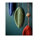 Knitted decorations in green, blue, and red hanging against a dark background