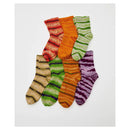Set of colorful striped socks on a white background