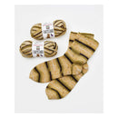 Two skeins of yarn and a pair of striped socks on a white background with 'Premier Yarns Farmstand' labels.