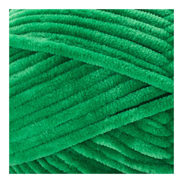 Close-up of green textured yarn on a white background