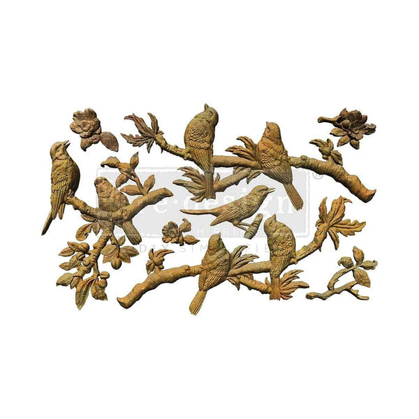 Decorative wall art with birds and branches on a white background