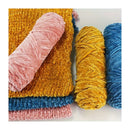 Colorful yarn skeins in pink, yellow, and blue on a white background