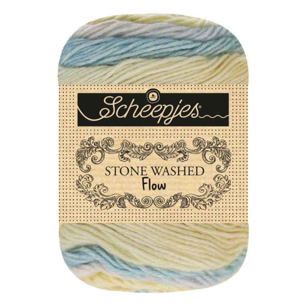Skein of yarn with 'Scheepjes' label on a white background