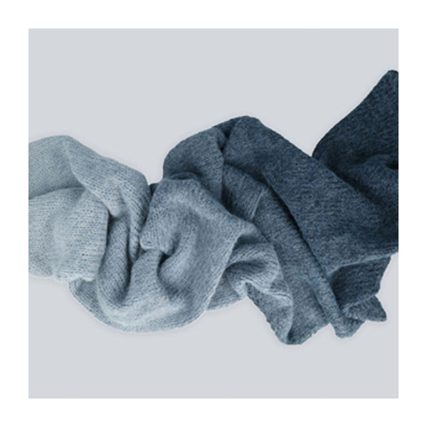 Two blue scrunchies on a light gray background