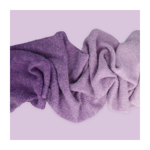 Purple textured fabric on a light purple background