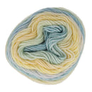 Multicolored yarn ball with shades of yellow, blue, and green on a white background