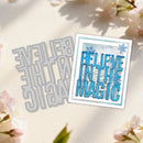 Metal die cut with 'Believe in the Magic' text and a card printed with the same design, surrounded by flowers.