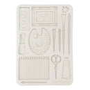 Decorative mold with artist-themed design on a white background