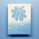 Notebook with a blue floral design on a light blue background
