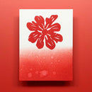 Red floral design on a white card with water droplets against a red background