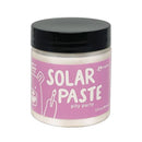 Jar of solar paste with pink label and black lid on white background