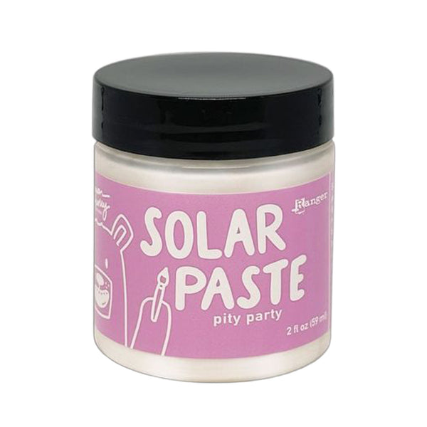 Jar of solar paste with pink label and black lid on white background