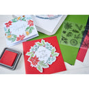 Collection of Christmas-themed greeting cards and stamp set on a white background