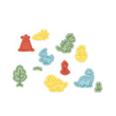Colorful dinosaur and plant-shaped stickers on a white background