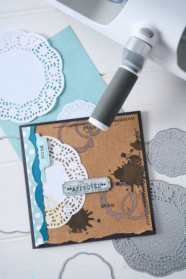 Handmade card with decorative elements on a white surface