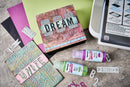 Artistic craft materials with 'DREAM' and 'CREATE' text on a textured surface.