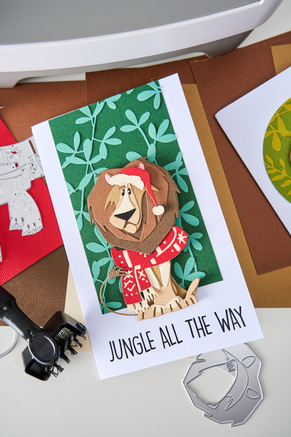 Card with a lion wearing a Santa hat and text 'Jungle All The Way' on a green background.