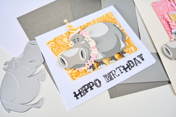 Birthday card with hippo design on a gray surface