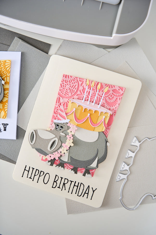 Card with hippo design and 'Hippo Birthday' text on a gray surface