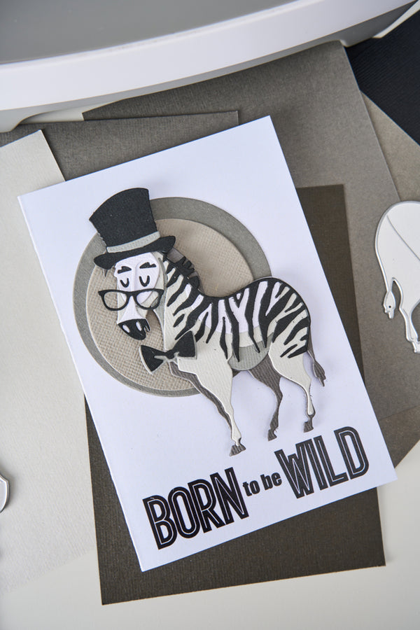 Card with a zebra wearing glasses and a top hat, labeled 'Born to be Wild', on a gray background.