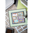 Framed artwork on a table with crafting materials