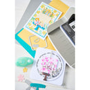 Card-making tools and templates on a white surface