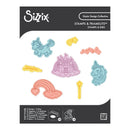 Sizzix stamps and framelets with unicorn, castle, and rainbow designs on a white background.