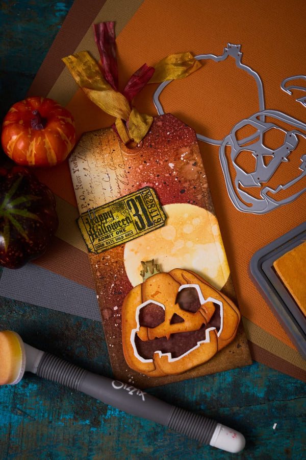 Halloween-themed cookie with pumpkin design and candy on a rustic surface.