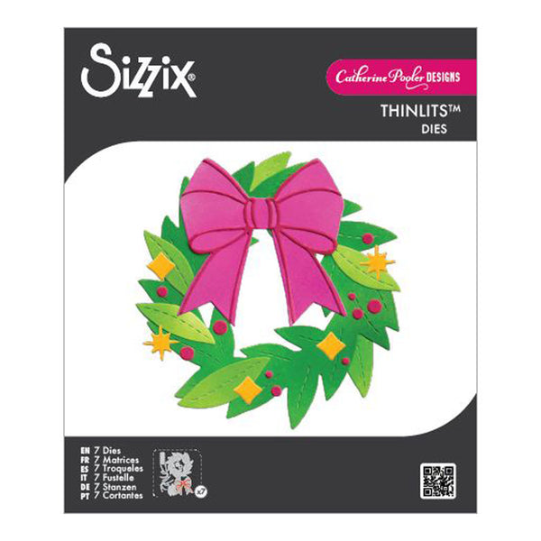 Sizzix Thinlits Dies packaging with a Christmas wreath and pink bow design.