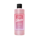 Pink bottle labeled 'Speedball Studio Plus' on a white background