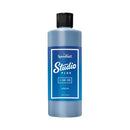 Blue bottle of Speedball Studio Plus ink on a white background