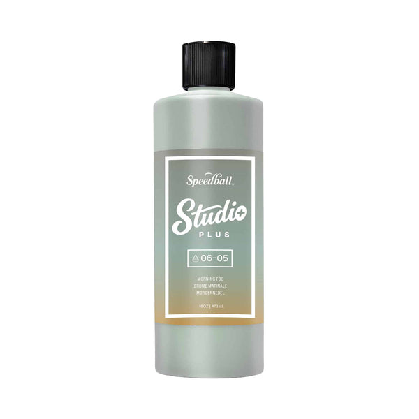 Bottle of Speedball Studio Plus ink on a white background