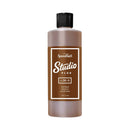 Brown bottle with a black cap on a white background, featuring Speedball Studio Plus branding.