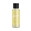 Yellow bottle with black cap labeled 'Speedball Studio Plus' on a white background